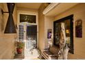 Inviting front porch with unique artistic elements and decorative touches adding character to the home's entrance at 1913 Five Iron Dr, Castle Rock, CO 80104