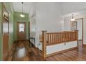 Inviting entryway with hardwood floors, coat closet, and neutral color scheme at 2838 S Heather Gardens Way # A, Aurora, CO 80014