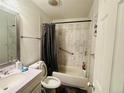 Cozy bathroom featuring a shower-tub combo with stylish tile surround and vanity at 5411 Chandler Way, Denver, CO 80239