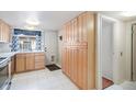 Bright kitchen with ample storage, wooden cabinets, and stainless steel appliances at 3593 S Kittredge St # E, Aurora, CO 80013