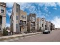 Row of contemporary townhouses showcasing sleek architecture and outdoor space at 2615 Mayotte Way, Castle Rock, CO 80109