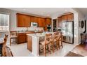 Spacious kitchen with granite countertops, stainless steel appliances, and large center island at 10480 Skyreach Rd, Highlands Ranch, CO 80126