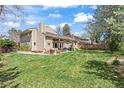 Spacious backyard featuring a patio area with seating, perfect for outdoor entertaining and relaxation in a serene setting at 4626 E Links Dr, Centennial, CO 80122