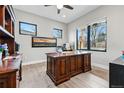 Stylish home office includes hardwood floors, natural light, and custom built-in shelving at 428 Pontiac St, Denver, CO 80220
