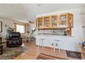 Cozy living room with hardwood floors, comfortable seating, and natural light at 9942 Lane St, Thornton, CO 80260