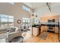 Living space offering a blend of comfort and style with sleek stainless steel appliances in the background at 5677 S Park Pl # D310, Greenwood Village, CO 80111