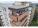 Balconies with seating, plants and a view of the city and mountains at 4570 E Yale Ave # 1104, Denver, CO 80222
