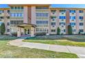 Inviting condo building featuring well-maintained landscaping and an attractive facade near a manicured lawn at 710 S Alton Way # 5A, Denver, CO 80247