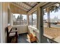 Bright screened porch, perfect for relaxing and enjoying the outdoors at 1256 Ulster St, Denver, CO 80220