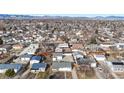 Expansive aerial view of a residential neighborhood with mountain views in the distance, perfect for families at 1345 S Meade St, Denver, CO 80219