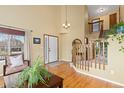Bright entryway featuring hardwood floors, staircase and tall ceilings that provides an open feel at 1898 Wilson Cir, Erie, CO 80516