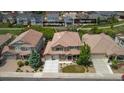 Aerial view of home at 1385 Candleglow St with well-maintained lawn and adjacent open space at 1385 Candleglow St, Castle Rock, CO 80109