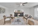 Bright living room with a fireplace, comfortable seating, natural light, and stylish decor at 1385 Candleglow St, Castle Rock, CO 80109