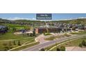 Aerial view of Clear Sky Elementary School with playground and surrounding neighborhood at 1385 Candleglow St, Castle Rock, CO 80109
