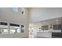 Bright, open concept living space with soaring ceilings and oversized windows for lots of natural light at 24661 E 33Rd Dr, Aurora, CO 80019