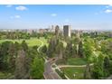 Scenic aerial view showcasing a lush green park with walking paths and the cityscape in the background at 1200 N Emerson St # 205, Denver, CO 80218