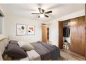 Cozy bedroom with a ceiling fan, closet, and natural light, creating a comfortable and inviting atmosphere at 1200 N Emerson St # 205, Denver, CO 80218