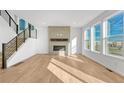 Bright and airy living room with hardwood floors, modern fireplace, and lots of natural light at 246 Mohawk Cir, Superior, CO 80027