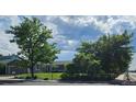 Well-kept lawn and mature trees compliment this home's inviting exterior at 2707 S Richfield St, Aurora, CO 80013