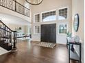 Stately foyer featuring high ceilings, hardwood floors, and a large entryway with transom windows at 8425 Green Island Cir, Lone Tree, CO 80124