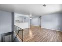Spacious living room with hardwood floors adjacent to kitchen and dining areas at 1155 S Fairplay Cir # D, Aurora, CO 80012