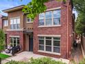 Beautiful brick townhome featuring a private entrance and inviting curb appeal in a desirable location at 8983 E Nichols Pl, Centennial, CO 80112