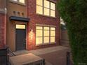 Charming red brick townhouse with a private entrance and manicured landscaping at 8983 E Nichols Pl, Centennial, CO 80112