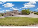 Well-maintained single-Gathering home with a three-car garage, storage shed and a lush lawn at 10044 E 146Th Pl, Brighton, CO 80602