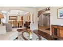 Open concept living space showcases hardwood floors, dining area, staircase, and great natural light at 6095 S Oswego St, Greenwood Village, CO 80111