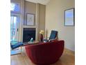 A comfortable living area includes modern seating, a fireplace, and large sliding glass doors at 4899 S Dudley St # K18, Littleton, CO 80123