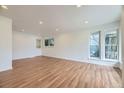 Bright living room with hardwood floors and ample natural light, creating a warm and inviting atmosphere at 1325 Lima St, Aurora, CO 80010