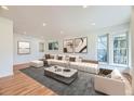 Bright living room with hardwood floors, stylish decor, and ample natural light, perfect for modern living at 1325 Lima St, Aurora, CO 80010