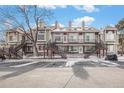 Charming townhomes with well-maintained exteriors, multiple stairways, and beautiful landscaping at 1885 S Quebec Way # C15, Denver, CO 80231