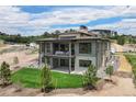Spacious backyard with a large deck perfect for outdoor entertaining at 6196 Oxford Peak Ln, Castle Rock, CO 80108