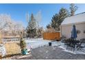 Fenced backyard with patio and outdoor seating area at 10000 E Yale Ave # 7, Denver, CO 80231