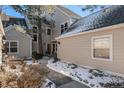 Home exterior with stone accents and landscaped garden at 10000 E Yale Ave # 7, Denver, CO 80231