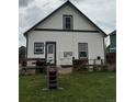 View of the home's exterior featuring a fenced backyard with a grassy lawn at 2874 Rose Hill St, Strasburg, CO 80136