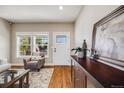 Welcoming entryway with hardwood floors, neutral paint, and stylish furnishings at 19294 E Warren Pl, Aurora, CO 80013