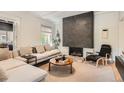Comfortable living room with a modern fireplace, plush sofa, and stylish decor at 785 Fillmore St, Denver, CO 80206