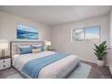 Bright bedroom with a large window and comfortable furnishings at 14704 E 2Nd Ave # E307, Aurora, CO 80011