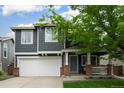 Charming two-story home with a two-car garage and covered front porch at 517 Sylvestor Trl, Highlands Ranch, CO 80129