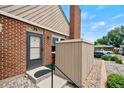 This townhouse features a brick facade, complemented by well-kept landscaping, and a cozy front entrance at 3300 W Florida Ave # 36, Denver, CO 80219