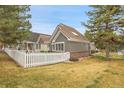 A fenced backyard with a cozy white fence at 2295 S Depew St, Denver, CO 80227