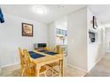Bright dining area with a view of the kitchen at 3600 S Pierce St # 7-104, Denver, CO 80235