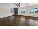 Spacious living room featuring a contemporary fireplace and ample natural light at 339 Rocking Chair Dr, Berthoud, CO 80513