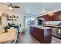 Modern eat-in kitchen featuring stainless steel appliances, granite countertops, and outdoor access at 5225 Balsam St # 1, Arvada, CO 80002