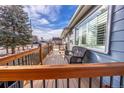 Inviting outdoor deck with comfortable seating, perfect for relaxing or entertaining at 705 Kenton St, Aurora, CO 80010