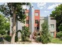 Modern multi-story home with unique architectural details, landscaping, and private gated yard at 377 Pearl St # 5, Boulder, CO 80302