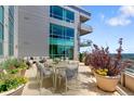 Wide shot of balcony with outdoor seating and a landscaped rooftop garden area at 2001 Lincoln St # 2524, Denver, CO 80202