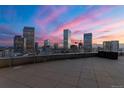 Wide shot of the balcony with a skyline view at sunset at 2001 Lincoln St # 2524, Denver, CO 80202